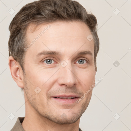 Joyful white adult male with short  brown hair and grey eyes