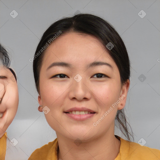 Joyful asian young-adult female with medium  brown hair and brown eyes