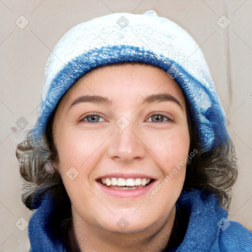 Joyful white young-adult female with long  brown hair and blue eyes