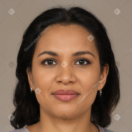 Joyful latino young-adult female with medium  brown hair and brown eyes