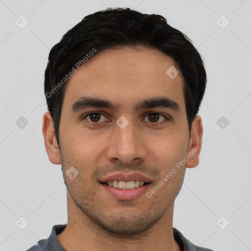 Joyful latino young-adult male with short  black hair and brown eyes