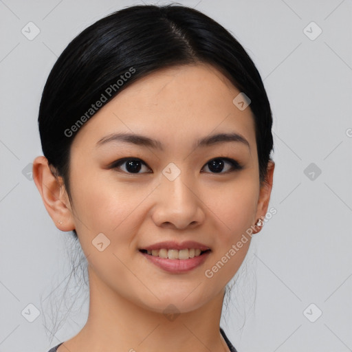 Joyful asian young-adult female with medium  black hair and brown eyes