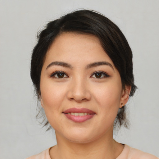 Joyful white young-adult female with medium  brown hair and brown eyes