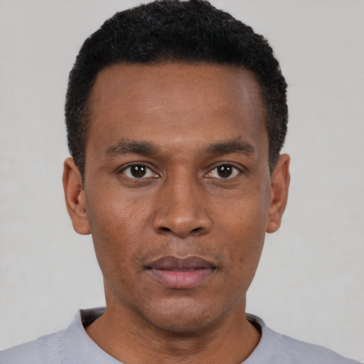Neutral black young-adult male with short  black hair and brown eyes