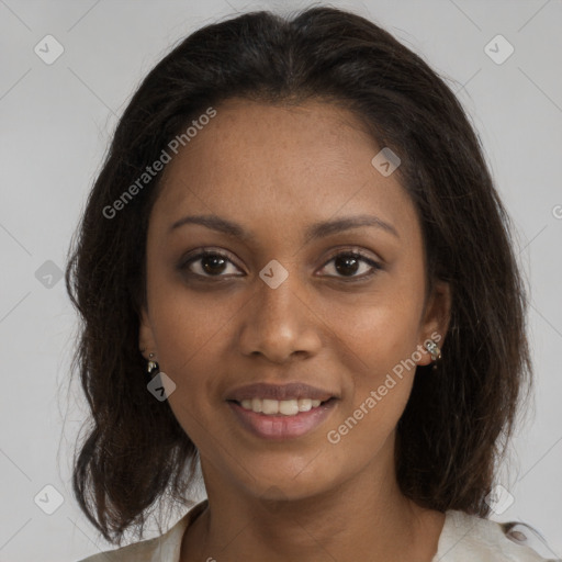 Joyful black young-adult female with medium  brown hair and brown eyes