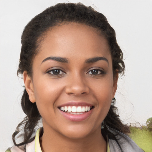 Joyful white young-adult female with medium  brown hair and brown eyes