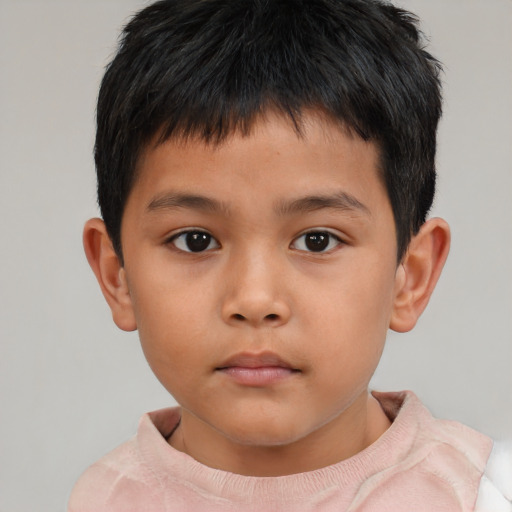 Neutral asian child male with short  brown hair and brown eyes