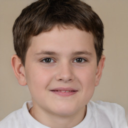 Joyful white child male with short  brown hair and brown eyes