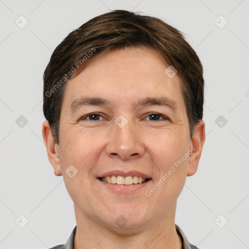 Joyful white adult male with short  brown hair and brown eyes