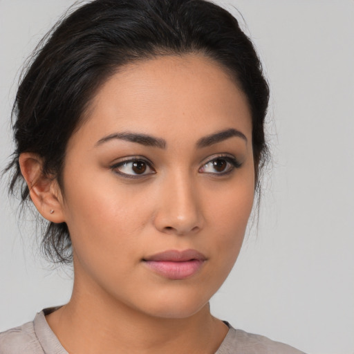 Neutral latino young-adult female with medium  brown hair and brown eyes