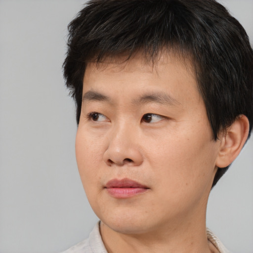 Neutral asian young-adult male with short  black hair and brown eyes