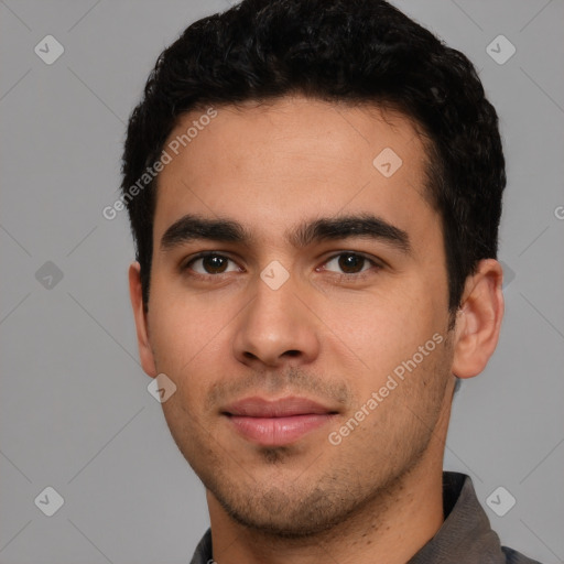 Joyful white young-adult male with short  black hair and brown eyes