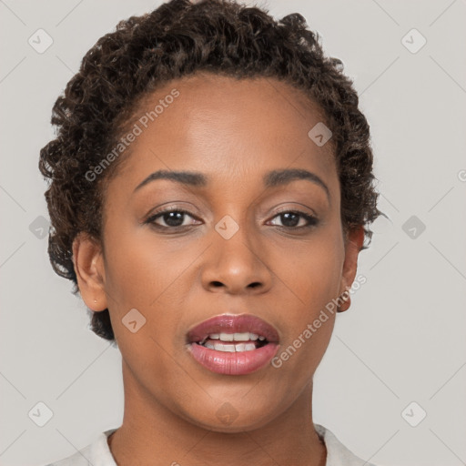 Joyful black young-adult female with short  brown hair and brown eyes