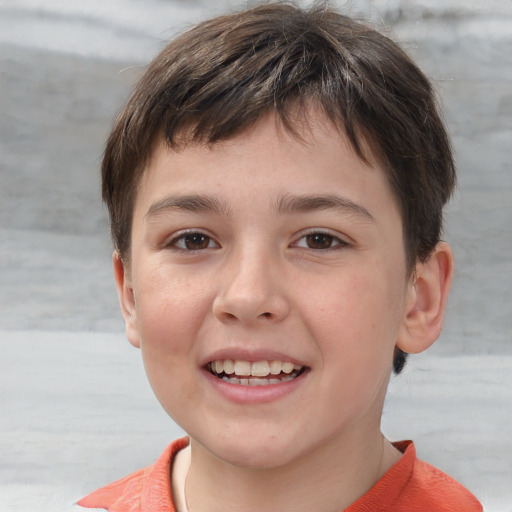 Joyful white child male with short  brown hair and brown eyes