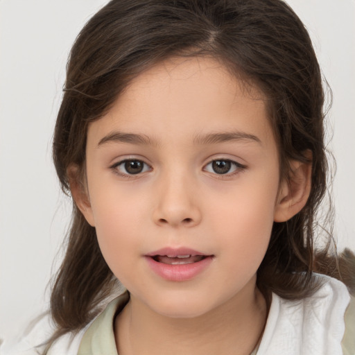 Joyful white child female with medium  brown hair and brown eyes