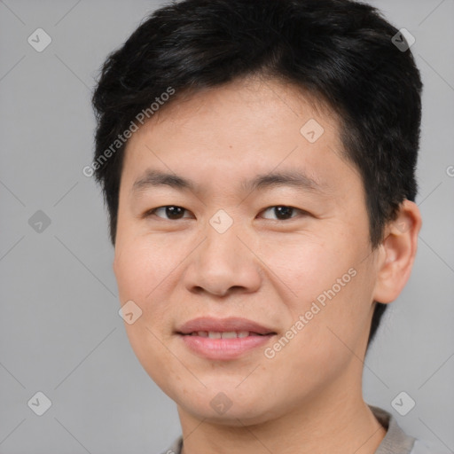 Joyful asian young-adult male with short  brown hair and brown eyes