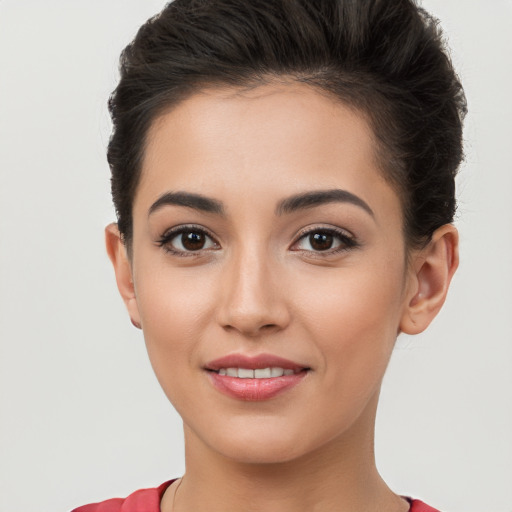 Joyful white young-adult female with short  brown hair and brown eyes