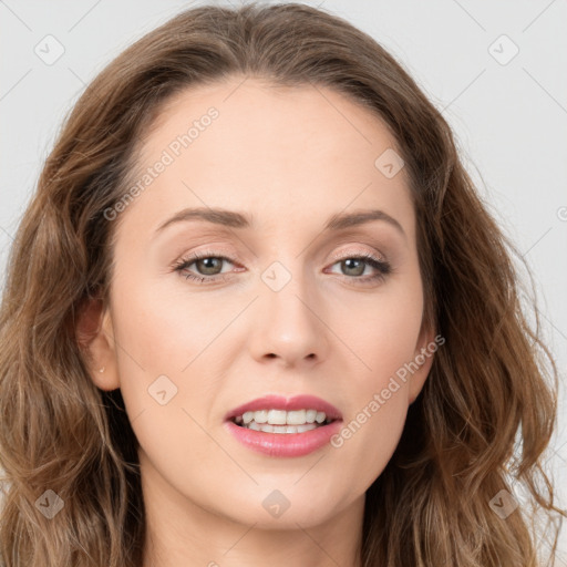 Joyful white young-adult female with long  brown hair and green eyes