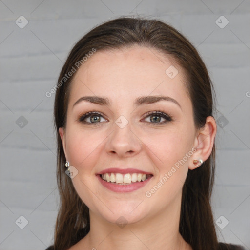 Joyful white young-adult female with long  brown hair and grey eyes