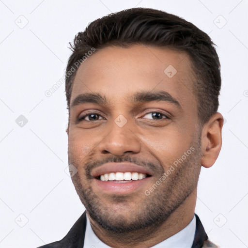 Joyful white young-adult male with short  black hair and brown eyes