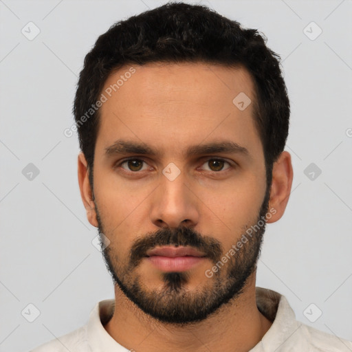 Neutral latino young-adult male with short  black hair and brown eyes