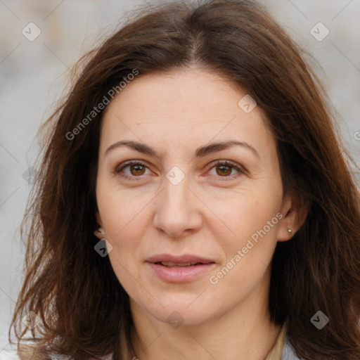 Joyful white adult female with long  brown hair and brown eyes