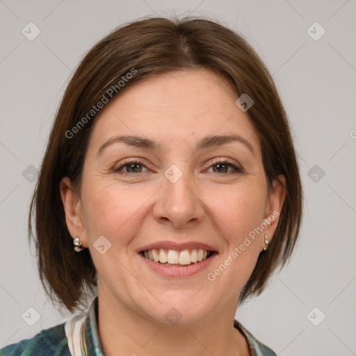 Joyful white adult female with medium  brown hair and grey eyes