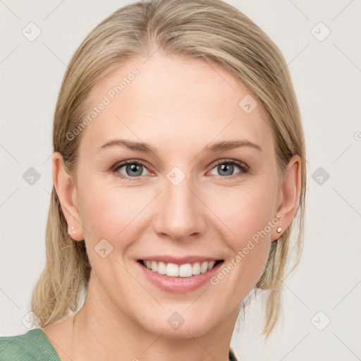 Joyful white young-adult female with medium  brown hair and blue eyes