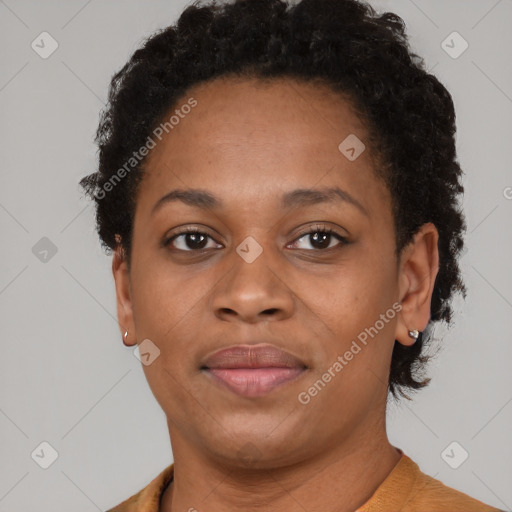 Joyful black adult female with short  brown hair and brown eyes