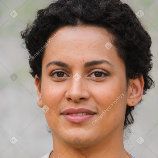 Joyful latino young-adult female with short  brown hair and brown eyes