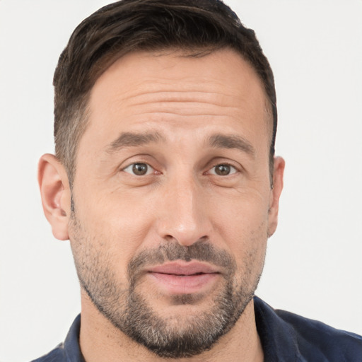 Joyful white adult male with short  brown hair and brown eyes