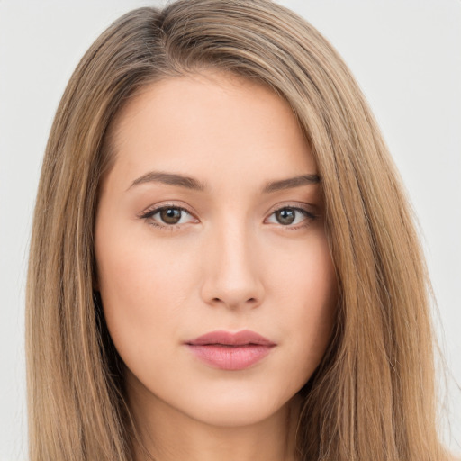 Neutral white young-adult female with long  brown hair and brown eyes