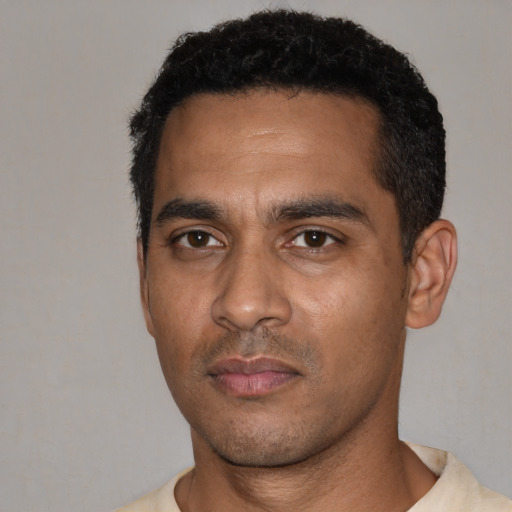 Neutral black young-adult male with short  black hair and brown eyes