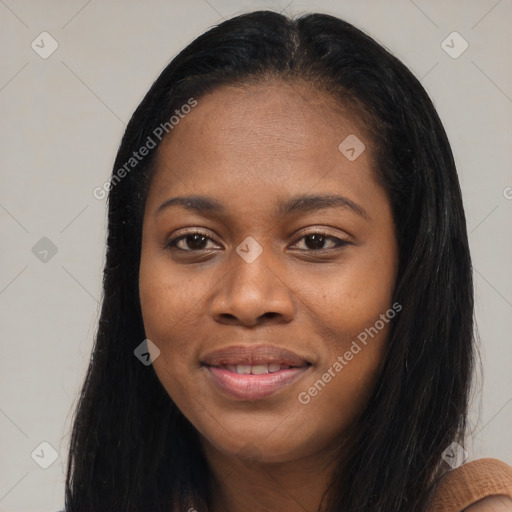 Joyful black young-adult female with long  black hair and brown eyes