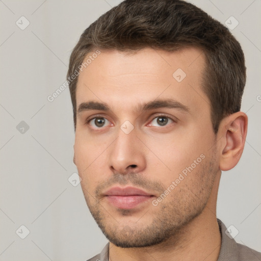 Neutral white young-adult male with short  brown hair and brown eyes