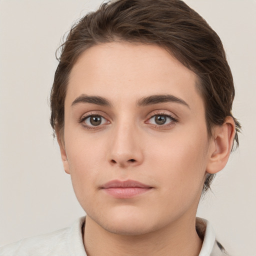 Neutral white young-adult female with short  brown hair and brown eyes