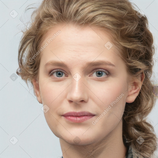 Joyful white young-adult female with long  brown hair and blue eyes