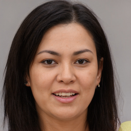 Joyful white young-adult female with long  brown hair and brown eyes