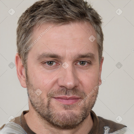 Joyful white adult male with short  brown hair and grey eyes