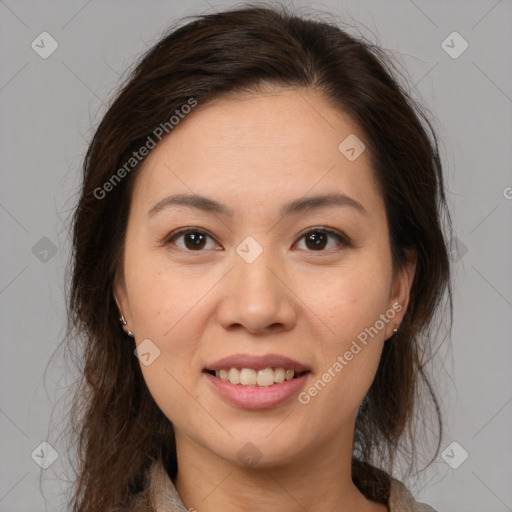 Joyful white young-adult female with medium  brown hair and brown eyes