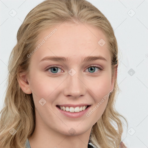 Joyful white young-adult female with long  brown hair and blue eyes