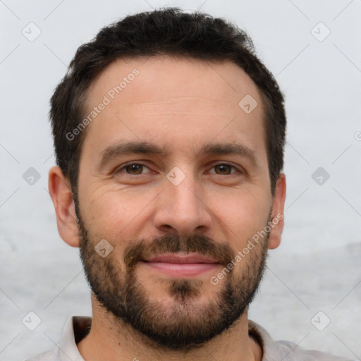 Joyful white young-adult male with short  brown hair and brown eyes