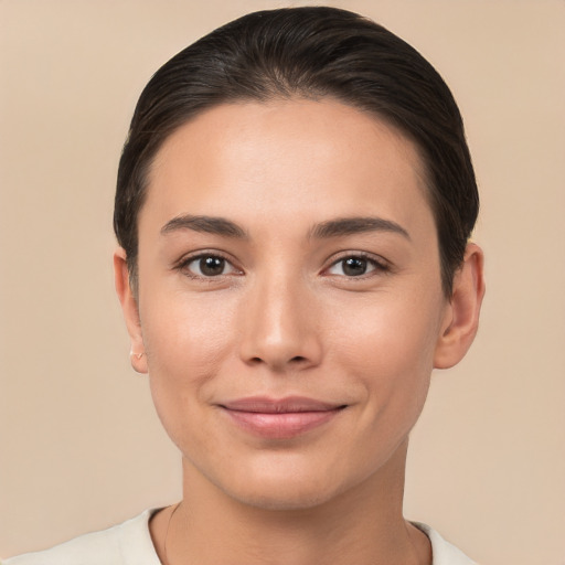 Joyful white young-adult female with short  brown hair and brown eyes