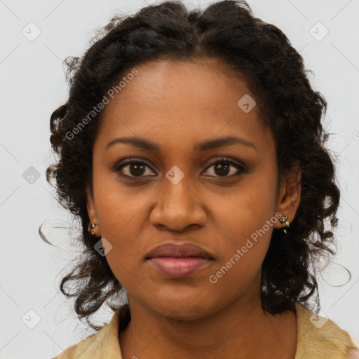 Joyful black young-adult female with long  brown hair and brown eyes