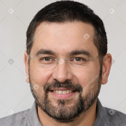 Joyful white adult male with short  black hair and brown eyes