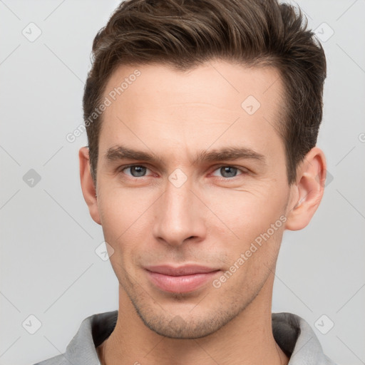 Neutral white young-adult male with short  brown hair and grey eyes