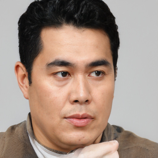 Neutral asian young-adult male with short  black hair and brown eyes