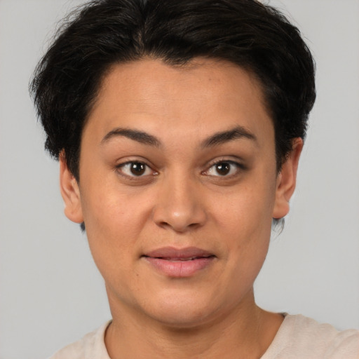 Joyful latino young-adult female with short  brown hair and brown eyes