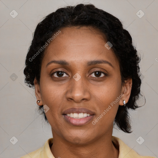 Joyful black young-adult female with medium  black hair and brown eyes