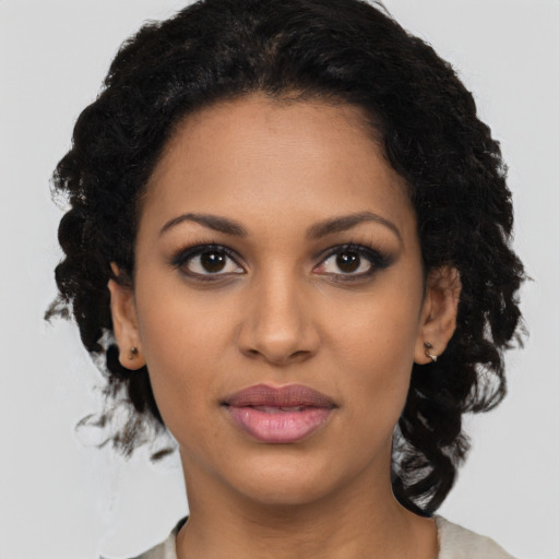Joyful latino young-adult female with medium  black hair and brown eyes